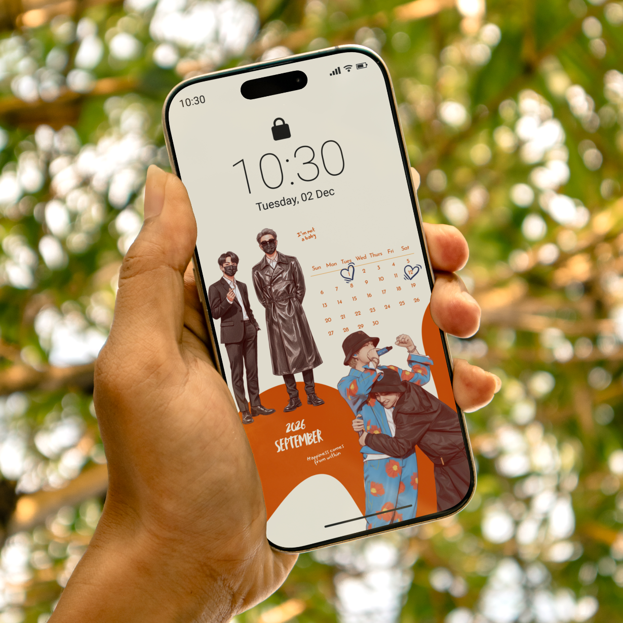 Hand holding a smartphone with a calendar app displaying a date and event against a blurred natural background.